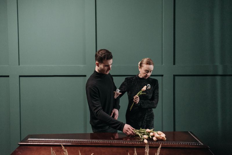 Family standing beside flowers - Final Expense Coverage